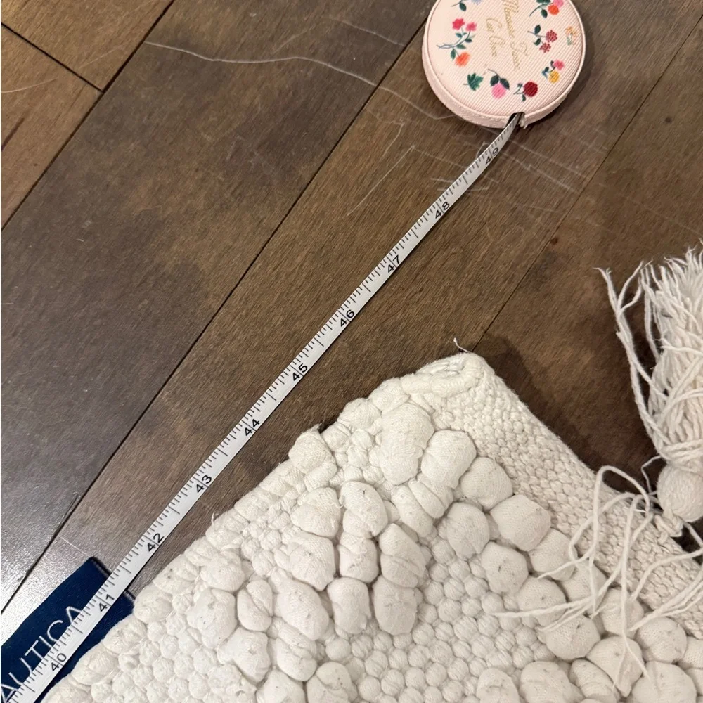 Nautica Cream Textured Bath Mat with Tassels